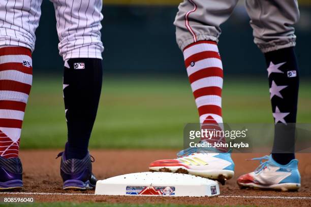 Colorado Rockies first baseman Mark Reynolds and Cincinnati Reds center fielder Billy Hamilton at first base with their 4th of July socks on July 4,...