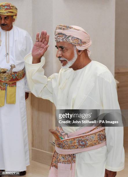 The Sultan of Oman, His Majesty Sultan Qaboos bin Said, waves goodbye to Queen Elizabeth II and Duke of Edinburgh, after watching an Equestrian and...