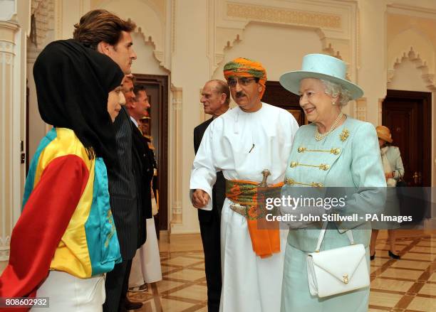 Queen Elizabeth II meets a female horse racing jockey, before she leaves with the Sultan of Oman His Majesty Sultan Qaboos bin Said and the Duke of...