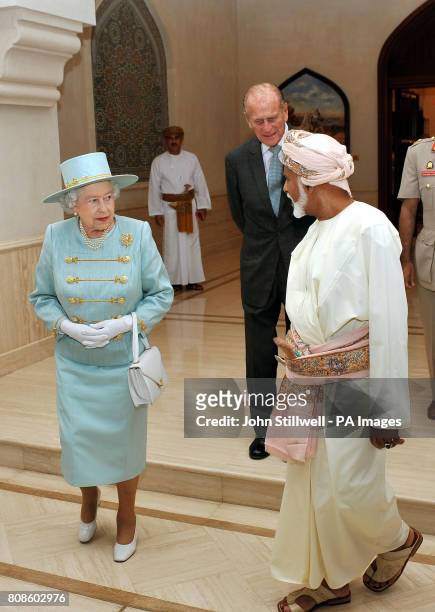 Queen Elizabeth II with the Sultan of Oman, His Majesty Sultan Qaboos bin Said, and the Duke of Edinburgh, leave the Grandstand after watching an...