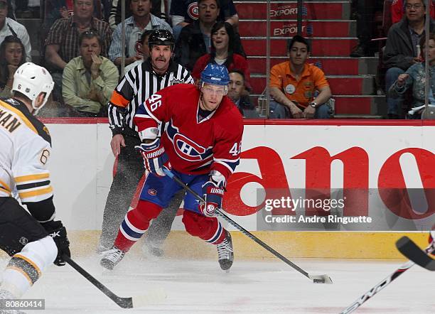 Andrei Kostitsyn of the Montreal Canadiens looks to pass the puck against the Boston Bruins during game seven of the 2008 NHL conference...