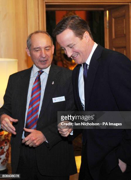 Britain's Prime Minister David Cameron speaks to SSAFA Chairman General Sir Kevin O'Donoghue at a reception in Downing Street celebrating the 125th...