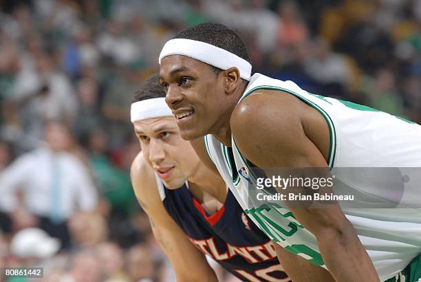 Rajon Rondo of the Boston Celtics and Mike Bibby of the Atlanta Hawks rest in Game Two of the Eastern Conference Quarterfinals during the 2008 NBA...