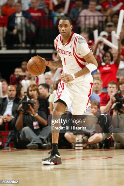 Tracy McGrady of the Houston Rockets moves the ball up court in Game Two of the Western Conference Quarterfinals against the Utah Jazz during the...