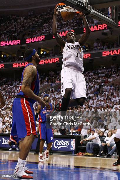 Samuel Dalembert of the Philadelphia 76ers dunks as Rasheed Wallace of the Detroit Pistons watches on in Game Three of the Eastern Conference...