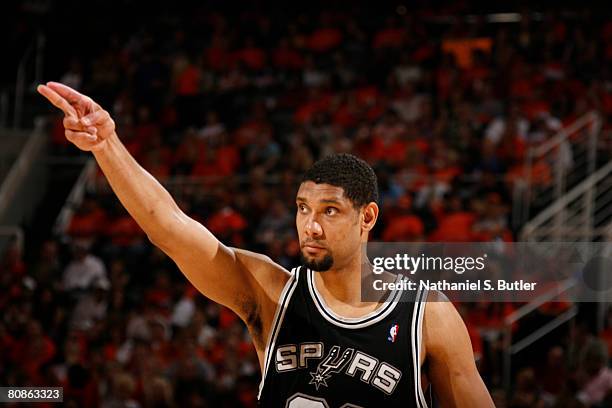 Tim Duncan of the San Antonio Spurs gestures towards the crowd in Game Three of the Western Conference Quarterfinals against the Phoenix Suns during...