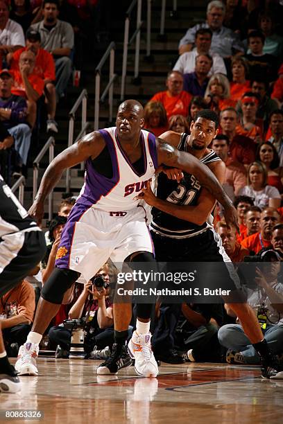 Shaquille O'Neal of the Phoenix Suns and Tim Duncan of the San Antonio Spurs fight for position in Game Three of the Western Conference Quarterfinals...