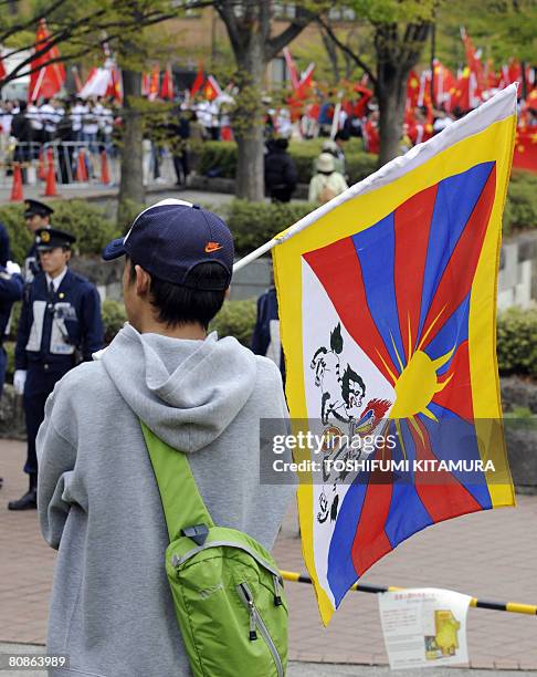 Pro-Tibet protester holds a Tibetan flag at the finishing the Beijing Olympic torch relay at the central Nagano city on April 26, 2008. The Beijing...