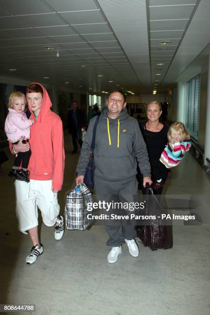 Shaun Ryder with wife Joanne with son Oliver and daughters Pearl and Lulu , as they arrive at Heathrow Airport, Middlesex, following his appearance...