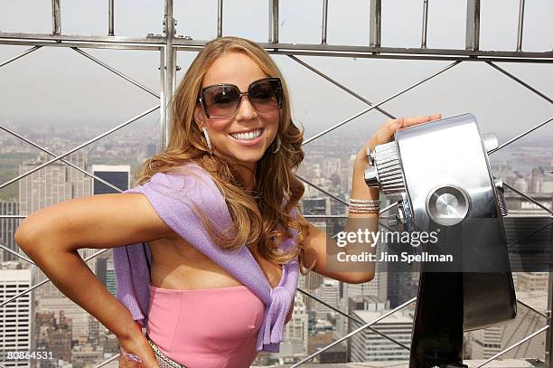 Mariah Carey lights up the Empire State Building to celebrate her new album "E=MC2" on April 25, 2008 in New York City.