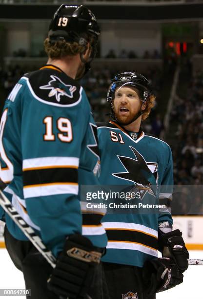Brian Campbell of the San Jose Sharks talks with teammate Joe Thornton during game one of the Western Conference Semifinals of the 2008 NHL Stanley...