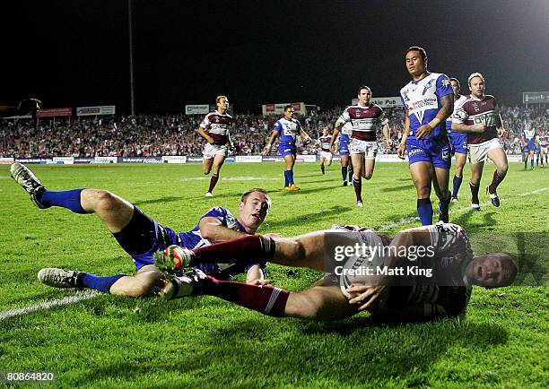 Steve Bell of the Sea Eagles scores a try in the corner during the round seven NRL match between the Manly Warringah Sea Eagles and the Bulldogs at...