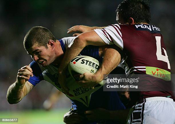 Andrew Ryan of the Bulldogs takes on the Sea Eagles defence during the round seven NRL match between the Manly Warringah Sea Eagles and the Bulldogs...