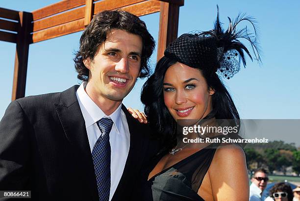 Radio host Andy Lee poses with partner model Megan Gale at the David Jones Marquee on Emirates Doncaster Day at the Royal Randwick Racecourse on...