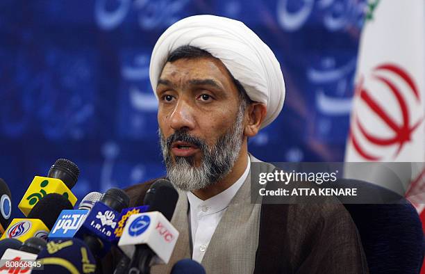 Iranian Interior Minister Mostafa Pour Mohammadi announces the final results of Iran's parliamentary elections during a press conference in Tehran on...