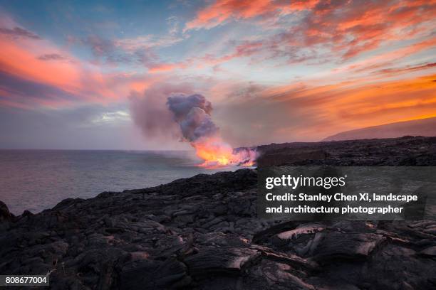 lava meets the ocean - hawaii volcanoes national park stock pictures, royalty-free photos & images