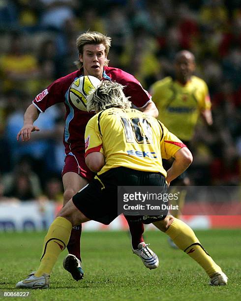 Darius Henderson of Watford battles for the ball with Kevan Hurst of Scunthorpe United during the Coca Cola Championship match between Watford and...