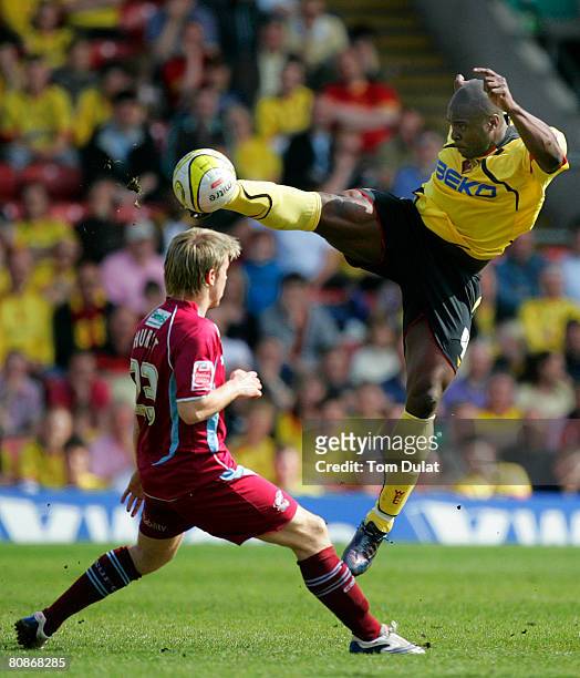 Dan Shittu of Watford battles for the ball with Kevan Hurst of Scunthorpe United during the Coca Cola Championship match between Watford and...
