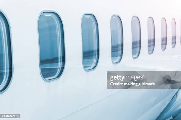 aircraft windows - aeroplane close up stock pictures, royalty-free photos & images