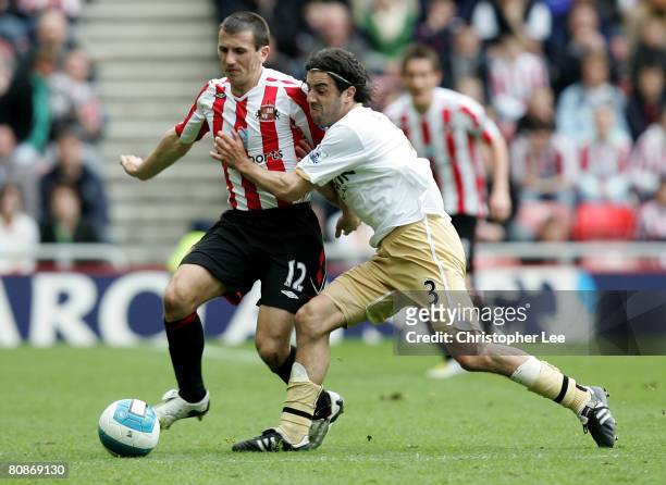 Liam Miller of Sunderland battles with Julio Arca of Middlesbrough during the Barclays Premiership match between Sunderland and Middlesbrough at the...