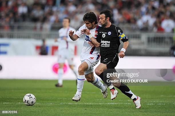 Caen's French defender Cedric Hengbart vies with Lyon's Brazilian midfielder Juninho Pernambucano during their French L1 football match Lyon vs....