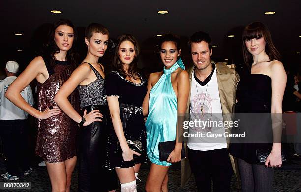 Jonathan Pease of "Australia's Next Top Model" and models from the show leave the departure lounge for the red carpet at the MTV Australia Awards...