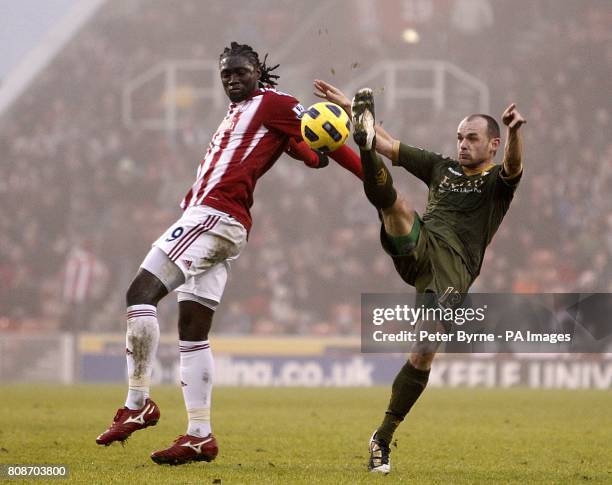 Fulham's Danny Murphy and Stoke City's Kenwyne Jones battle for the ball