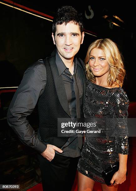 Musicians Natalie Bassingthwaighte and James Ash from Rogue Traders leave the departure lounge for the red carpet at the MTV Australia Awards 2008 at...