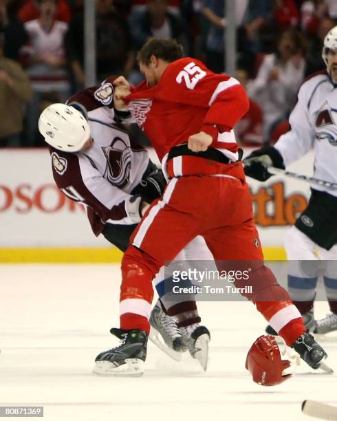 Darren McCarty of the Detroit Red Wings and Cody McCormick of the Colorado Avalanche fight during game two of the Western Conference Semifinals of...