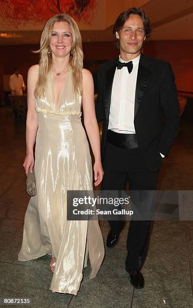 Designer Jette Joop and friend Christian Elsen attend the Innocence in Danger Art for Children charity gala at the Hyatt hotel April 26, 2008 in...