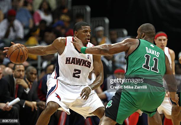 Guard Joe Johnson of the Atlanta Hawks dribbles around forward Glen Davis of the Boston Celtics during Game Three of the Eastern Conference...