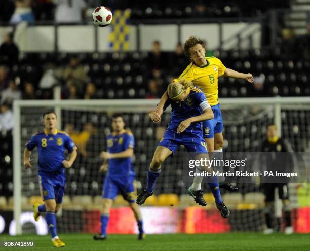 Brazil's Lucas Leiva wins a header over Ukraine's Anatoiy Tymoshchuk during the International Friendly at Pride Park, Derby.