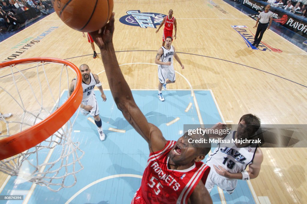 Mutombo Rockets Dikembe Mutombo of the Houston Rockets scores a layup on Mehmet Okur ...
