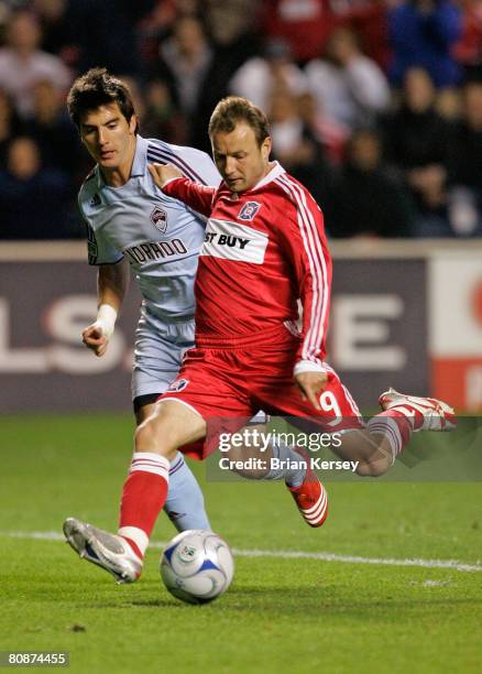 Tomasz Frankowski of the Chicago Fire takes a shot on the goal as Facundo Erpen of the Colorado Rapids defends during the second half at Toyota Park...