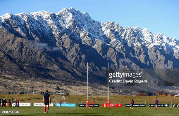 Jonathan Sexton practices his kicking with the Remarkables mountain range in the background during the British & Irish Lions training session at the...