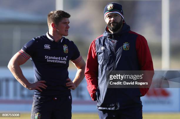 Owen Farrel talks to his father and Lions defence coach Andy Farrell during the British & Irish Lions training session at the Queenstown Event Centre...
