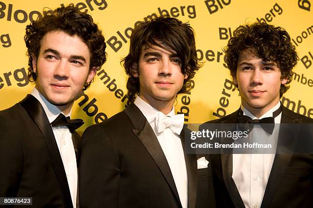 Musicians the Jonas Brothers arrive at the Bloomberg afterparty following the White House Correspondents' Dinner April 26, 2008 in Washington, DC.