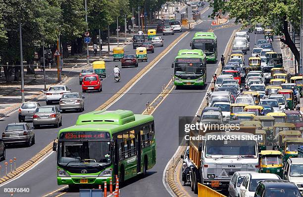 Buses ply on the road as commuters are stuck in a traffic jam at the Bus Rapid Transit corridor in New Delhi, on April 27, 2008. India's capital has...