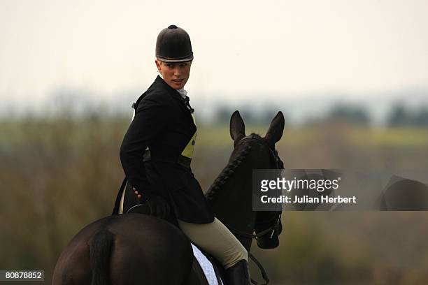 Zara Phillips warms her horse Tallyho Sambucca up before taking part in the Dressage section at Withington Manor Horse Trials at the Withington...