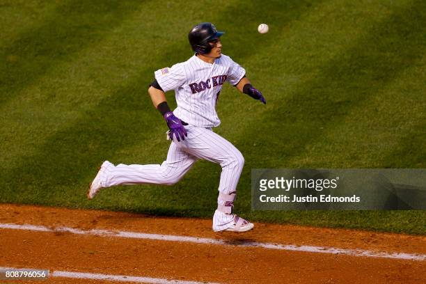 Tony Wolters of the Colorado Rockies was unable to beat out the throw to first base after striking out for the second out of the seventh inning...
