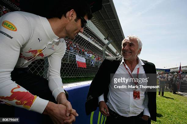 Dietrich Mateschitz, owner of the Red Bull Racing team, meets one of his drivers, Mark Webber of Australia on the grid before the Spanish Formula One...