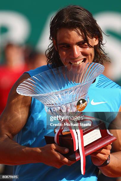 Rafael Nadal of Spain holds the Masters Trophy after his 7-5,7-5 victory in the singles final match against Roger Federer of Switzerland on day nine...