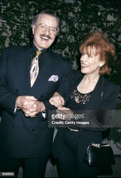 Singer/actor Robert Goulet and his wife Vera Novak laugh outside Spago's restaurant April 23, 2001 in Los Angeles, CA.