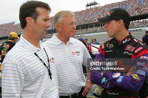 Team president J.D. Gibbs and team owner Joe Gibbs, speaks with Denny Hamlin, driver of the FedEx Toyota, prior to the NASCAR Sprint Cup Series...