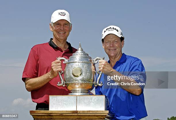 Andy North and Tom Watson pose with the trophy after winning the Legends Division at the Liberty Mutual Legends of Golf at Westin Savannah Harbor...