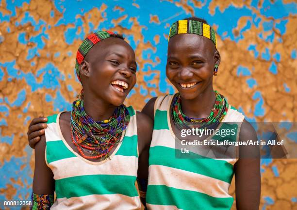 Hamer tribe young women laughing, Omo valley, Dimeka, Ethiopia on June 10, 2017 in Dimeka, Ethiopia.