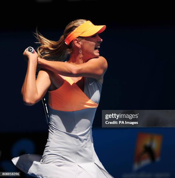 Russia's Maria Sharapova in action against Thailand's Tamarine Tanasugarn during day one of the 2011 Australian Open at Melbourne Park in Melbourne,...