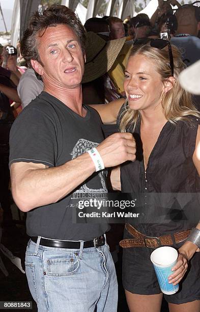 Actor/activist Sean Penn and actress Sienna Miller pose during day 3 of the Coachella Valley Music And Arts Festival held at the Empire Polo Field on...