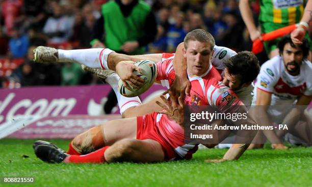 Wigan Warriors' Ryan Hoffman goes over to score the first try of the game during the Engage Super League match at the Millennium Stadium, Cardiff.