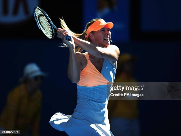 Russia's Maria Sharapova in action against France's Virginie Razzano during day three of the 2011 Australian Open at Melbourne Park in Melbourne,...